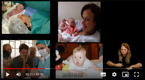 Quatro fotos. Na primeira, à esquerda e acima,
uma mulher com roupa verde e azul de hospital, com touca branca, segura
um bebe recém-nascido com o braço. Na segunda, abaixo, atrás de um
vidro, um homem ao centro, com as mãos no rosto, chora emocionado; à sua
volta, duas mulheres e um homem mais velhos também choram. À frente do
vidro, uma mulher com roupa e touca azul, usando máscara, mostra um
bebê. Na terceira foto, acima e ao centro, uma mulher segura um bebê no
colo, vestindo macacão rosa. Na quarta foto, ao centro e abaixo, bebê
branca, de olhos azuis e cabelo loiro, está ao lado de uma pelúcia. À
direita, com fundo preto, aparece a intérprete de Libras.